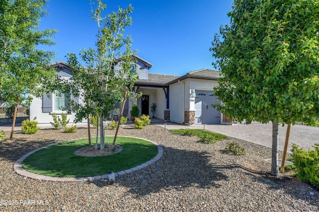 5306 Rocky Vista Dr, Prescott, AZ 86301 - view of property hidden behind natural elements with stucco siding, an attached garage, stone siding, and driveway