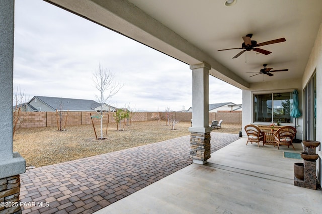 5306 Rocky Vista Dr, Prescott, AZ 86301 - fenced backyard with a ceiling fan and a patio
