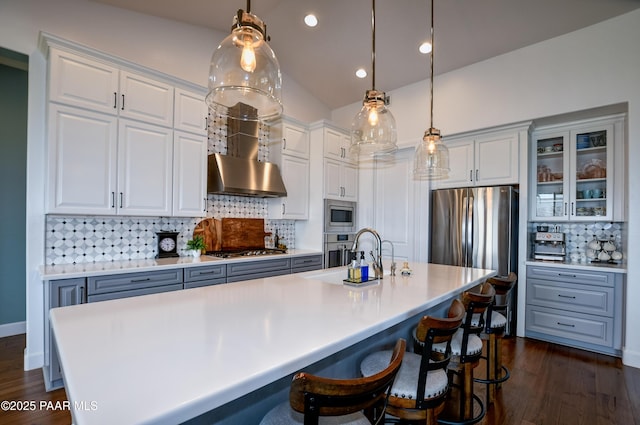 5306 Rocky Vista Dr, Prescott, AZ 86301 - kitchen featuring appliances with stainless steel finishes, a sink, tasteful backsplash, dark wood-type flooring, and white cabinetry
