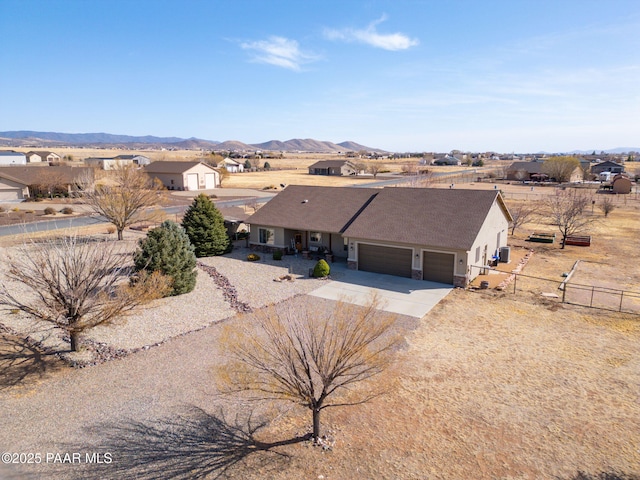 birds eye view of property featuring a mountain view