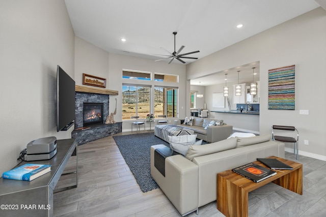 3771 Blazing Ore Trl, Prescott, AZ 86301 - living area featuring ceiling fan, a stone fireplace, recessed lighting, and wood finished floors