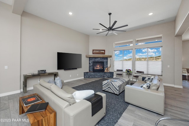 3771 Blazing Ore Trl, Prescott, AZ 86301 - living room with ceiling fan, a fireplace, and light hardwood / wood-style flooring