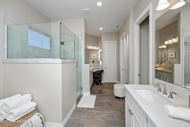 3771 Blazing Ore Trl, Prescott, AZ 86301 - bathroom with hardwood / wood-style floors, vanity, and a shower with shower door