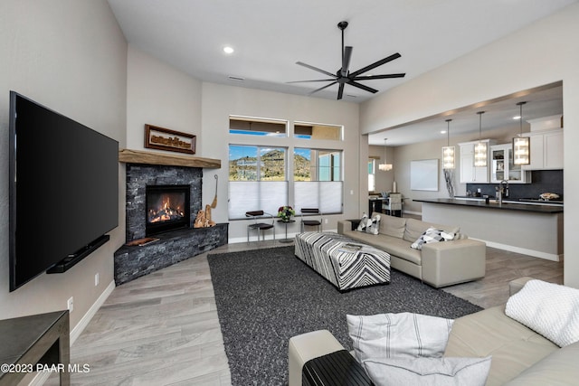 3771 Blazing Ore Trl, Prescott, AZ 86301 - living area featuring a ceiling fan, a fireplace, light wood-style floors, and recessed lighting