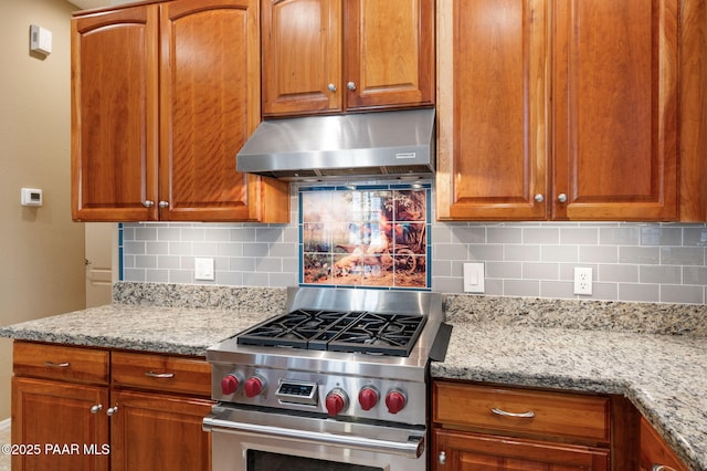 7708 N Siesta Sunset Ln, Prescott Valley, AZ 86315 - kitchen with stainless steel stove, exhaust hood, tasteful backsplash, and light stone counters