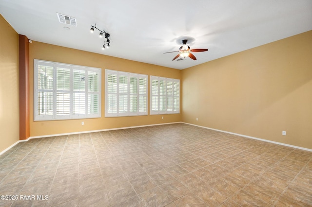 7708 N Siesta Sunset Ln, Prescott Valley, AZ 86315 - empty room with ceiling fan, baseboards, and track lighting