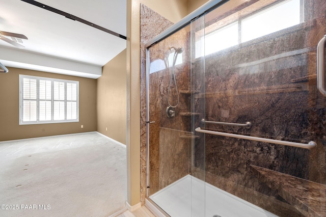 7708 N Siesta Sunset Ln, Prescott Valley, AZ 86315 - full bath featuring a stall shower, ceiling fan, and baseboards