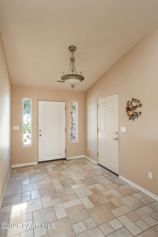 1269 N Oxbow Dr, Dewey-Humboldt, AZ 86327 - foyer entrance featuring vaulted ceiling and baseboards