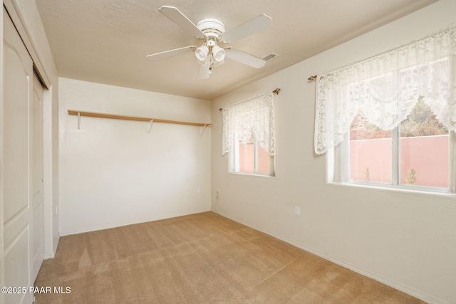 1269 N Oxbow Dr, Dewey-Humboldt, AZ 86327 - unfurnished bedroom featuring carpet floors, a closet, and ceiling fan