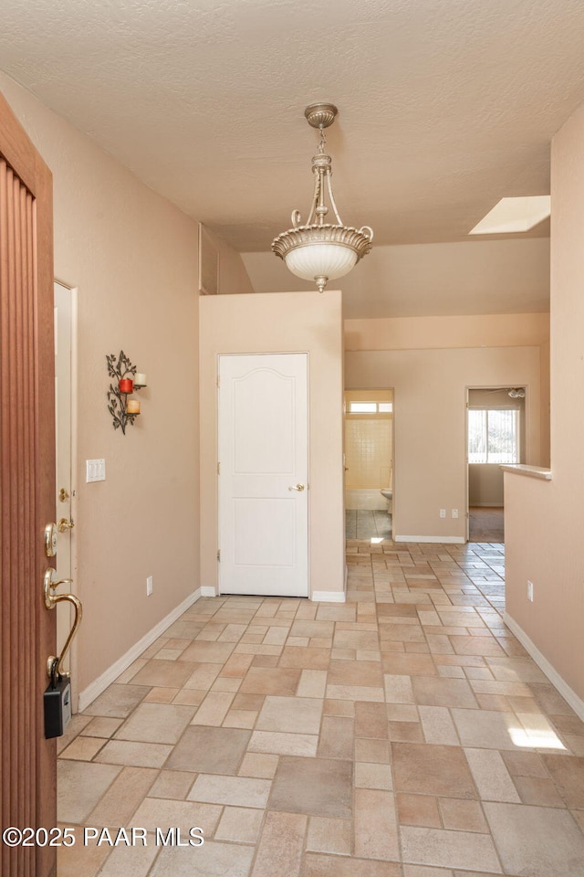 1269 N Oxbow Dr, Dewey-Humboldt, AZ 86327 - unfurnished room featuring a textured ceiling and a skylight