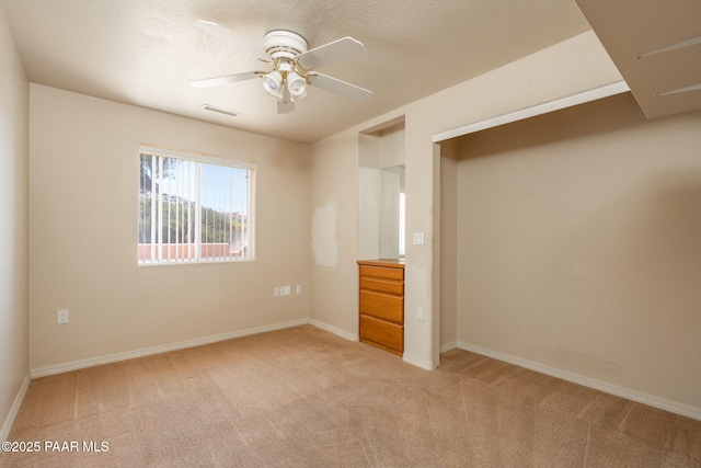 1269 N Oxbow Dr, Dewey-Humboldt, AZ 86327 - unfurnished bedroom with light colored carpet and a ceiling fan