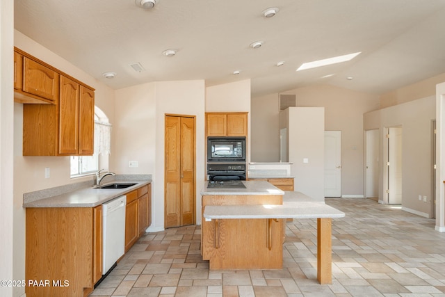 1269 N Oxbow Dr, Dewey-Humboldt, AZ 86327 - kitchen with black appliances, a center island, light countertops, vaulted ceiling, and stone tile floors