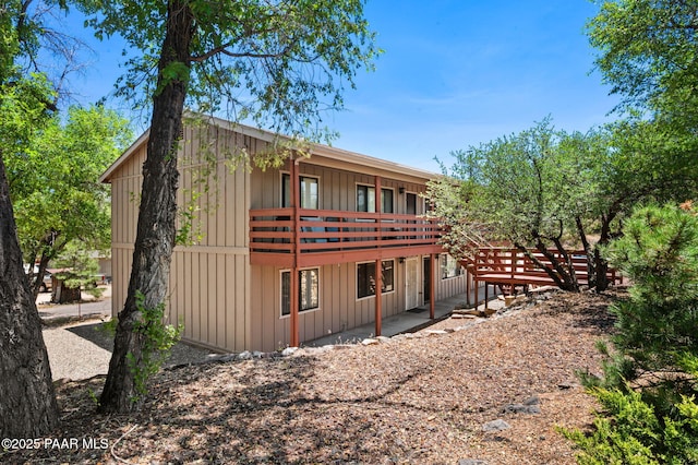 290 Madison Ave, Prescott, AZ 86301 - rear view of house with board and batten siding and a deck