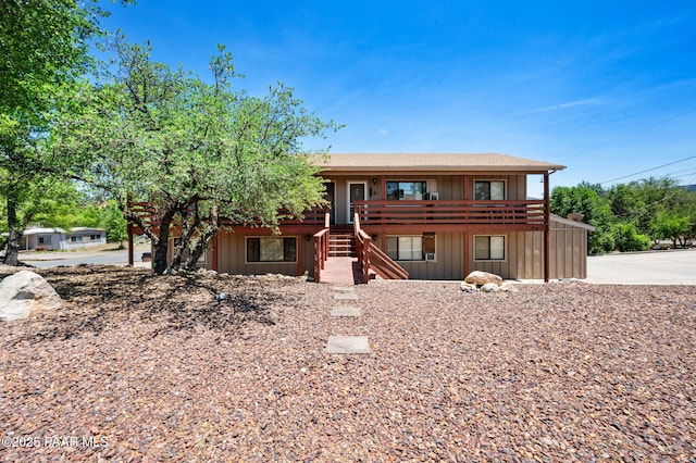 290 Madison Ave, Prescott, AZ 86301 - view of front of house featuring stairs, board and batten siding, a wooden deck, and concrete driveway