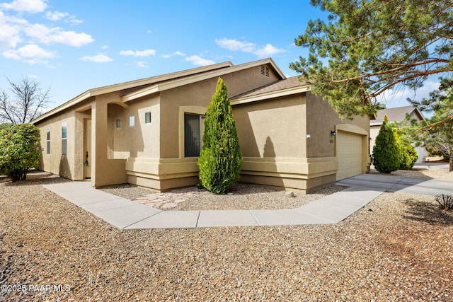 view of front of house with an attached garage and stucco siding