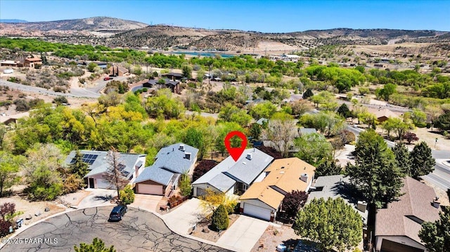 drone / aerial view featuring a residential view and a mountain view