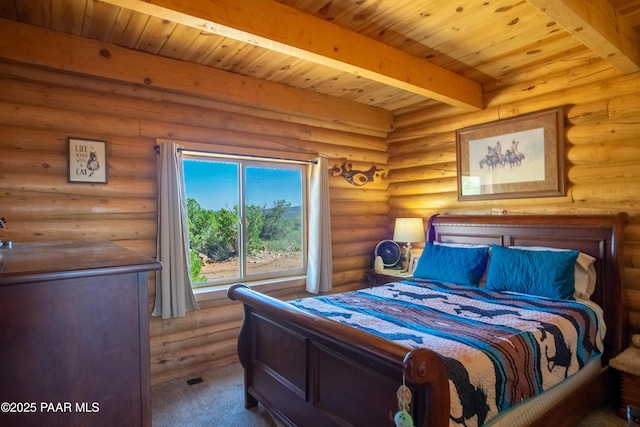 carpeted bedroom with beamed ceiling and wood ceiling