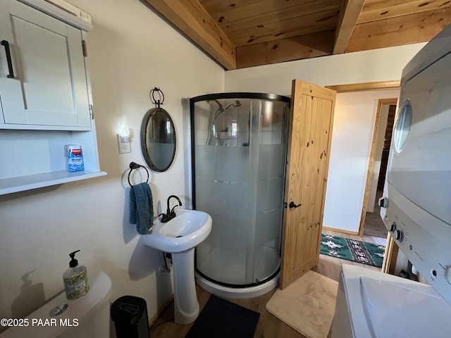 bathroom with an enclosed shower, wooden ceiling, and beamed ceiling