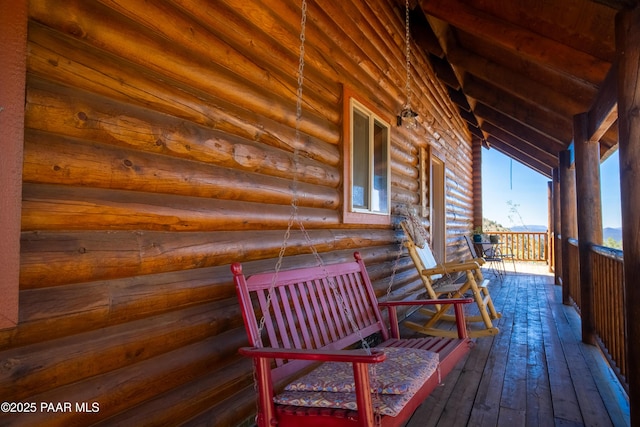 wooden deck featuring covered porch