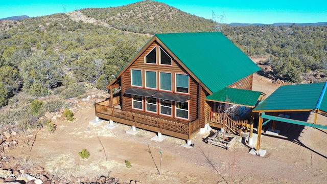 rear view of property with a mountain view