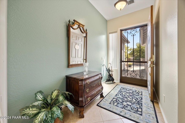 entrance foyer featuring light tile patterned floors