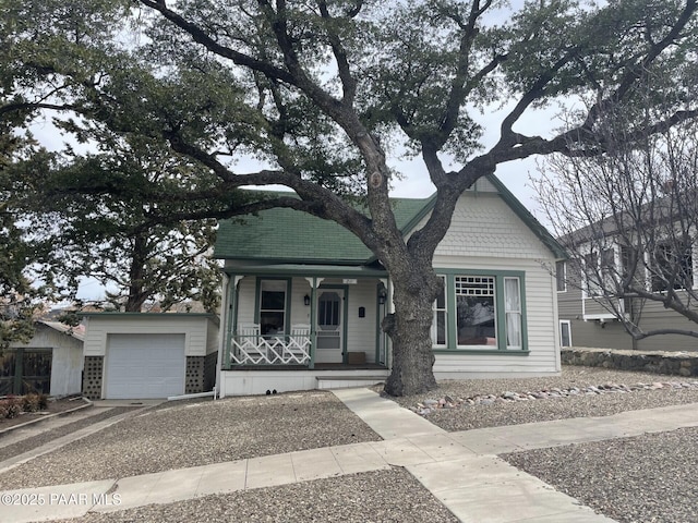 view of front of home featuring a porch and an attached garage