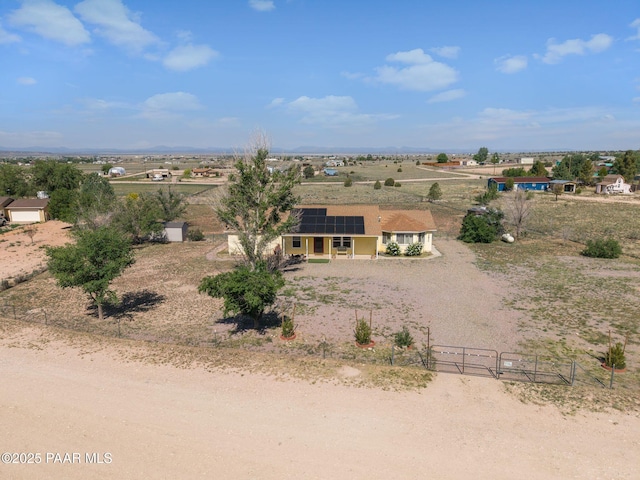 25820 N Poppy Dr, Paulden, AZ 86334 - view of front of home featuring roof mounted solar panels, a gate, and a view of rural / pastoral area