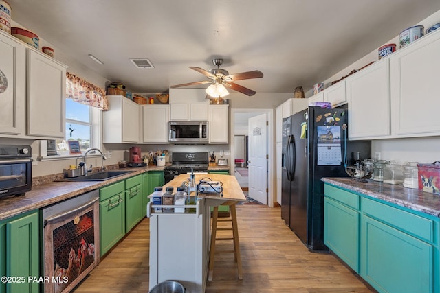 25820 N Poppy Dr, Paulden, AZ 86334 - kitchen featuring black appliances, a sink, wine cooler, light wood finished floors, and ceiling fan