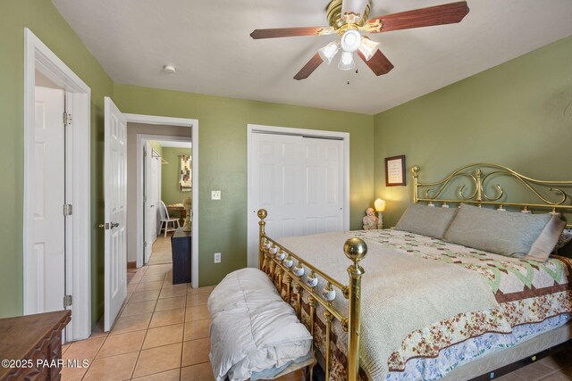 25820 N Poppy Dr, Paulden, AZ 86334 - bedroom with tile patterned floors, a closet, and ceiling fan