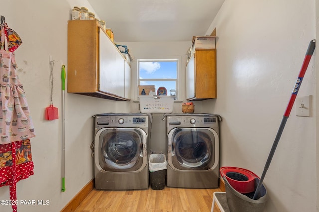 25820 N Poppy Dr, Paulden, AZ 86334 - laundry room featuring washing machine and dryer, cabinet space, and light wood finished floors