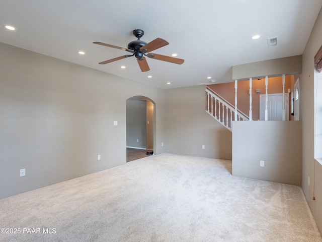 5700 N Concho Dr, Prescott Valley, AZ 86314 - carpeted empty room featuring a ceiling fan, arched walkways, recessed lighting, and stairway