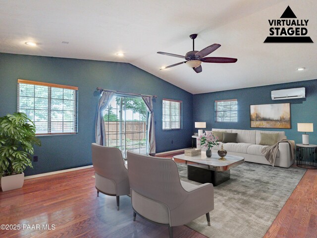 5700 N Concho Dr, Prescott Valley, AZ 86314 - living area featuring an AC wall unit, wood finished floors, ceiling fan, plenty of natural light, and lofted ceiling
