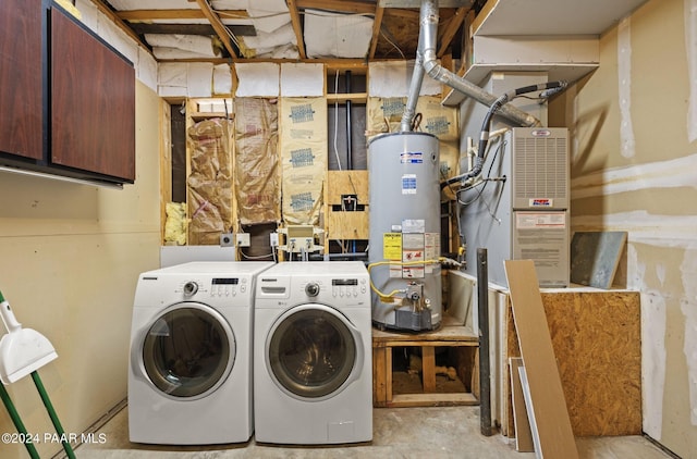 laundry area featuring gas water heater and washing machine and dryer