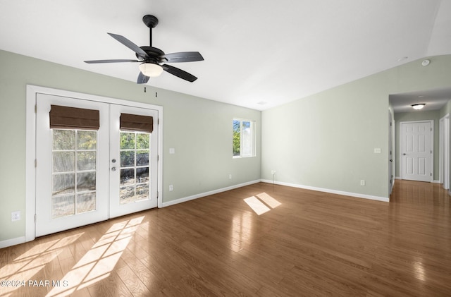 unfurnished room featuring ceiling fan, french doors, dark wood-type flooring, and lofted ceiling