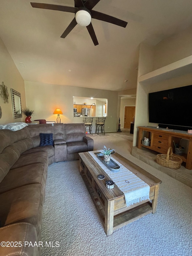 carpeted living room featuring ceiling fan