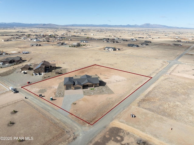 bird's eye view featuring view of desert, a rural view, and a mountain view