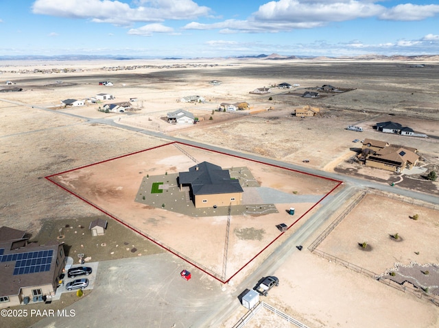 birds eye view of property with view of desert