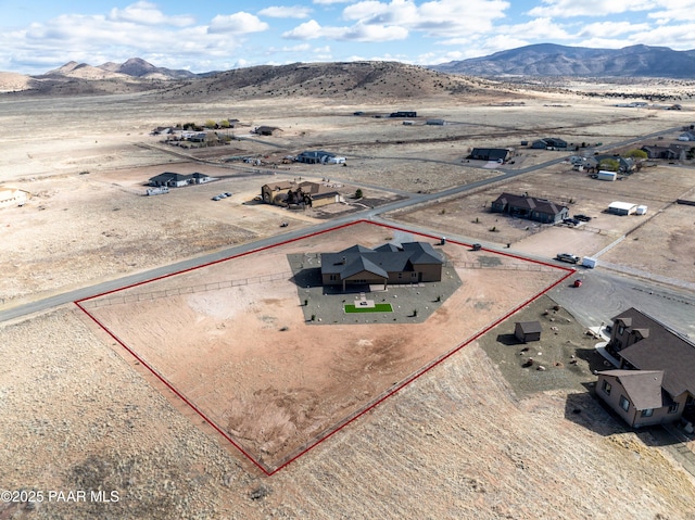 bird's eye view with view of desert and a mountain view