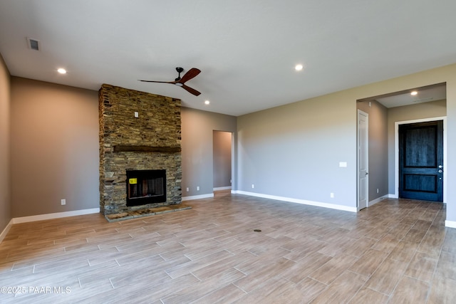 unfurnished living room featuring visible vents, baseboards, light wood-type flooring, and ceiling fan