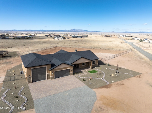 birds eye view of property with a mountain view