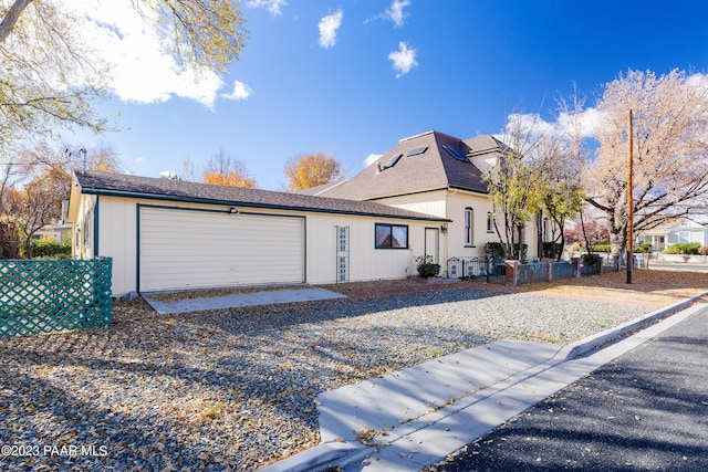 view of front of property with a garage