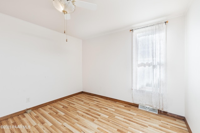 empty room featuring light hardwood / wood-style floors and ceiling fan