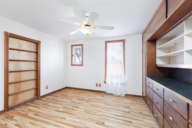 unfurnished bedroom featuring ceiling fan and light hardwood / wood-style flooring