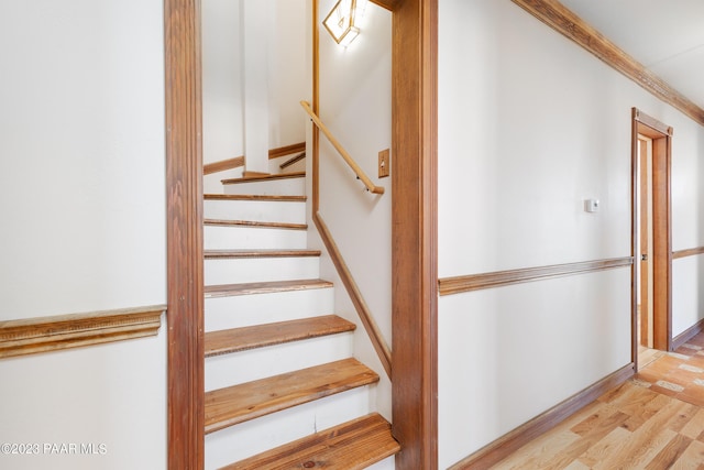 stairs with wood-type flooring