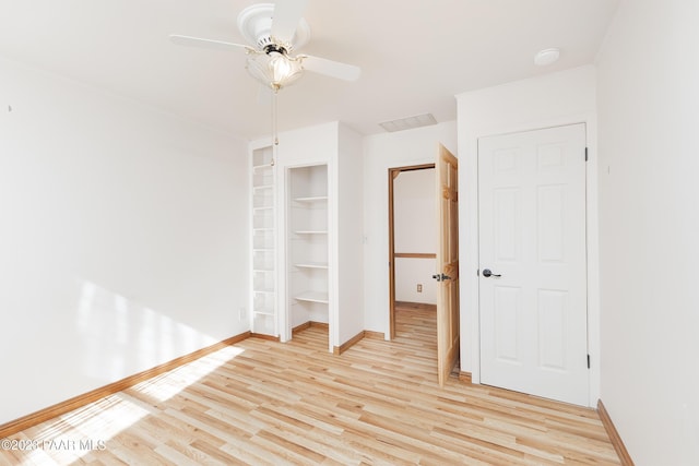 unfurnished bedroom with light hardwood / wood-style floors and ceiling fan