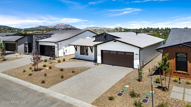 modern farmhouse featuring a mountain view and a garage