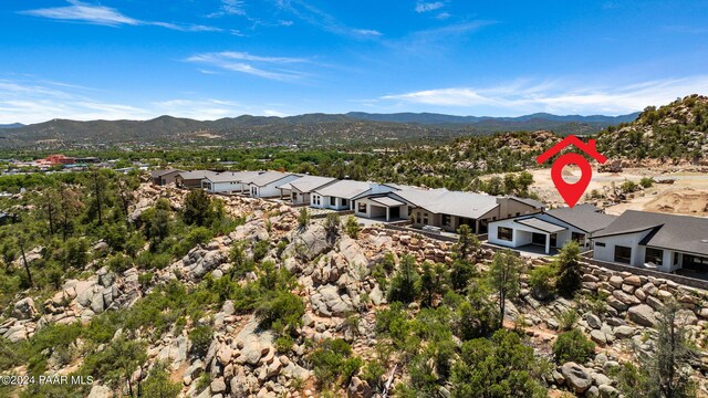 birds eye view of property with a mountain view