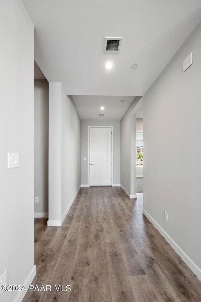 hall with light hardwood / wood-style flooring