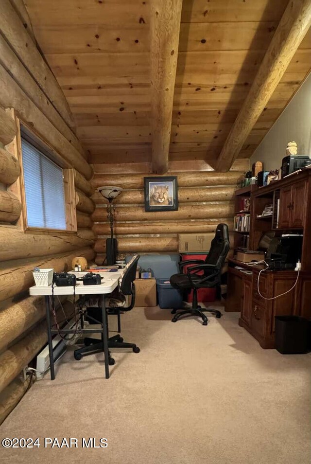 carpeted office space with beam ceiling, rustic walls, and wooden ceiling