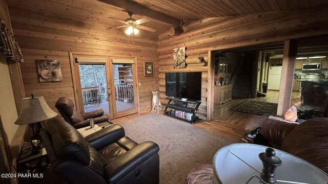 living room featuring hardwood / wood-style floors, wooden ceiling, french doors, vaulted ceiling with beams, and ceiling fan